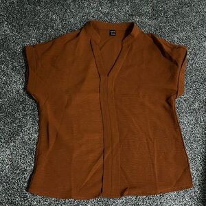 Cute rust/burnt  orange colored blouse! Worn once excellent condition